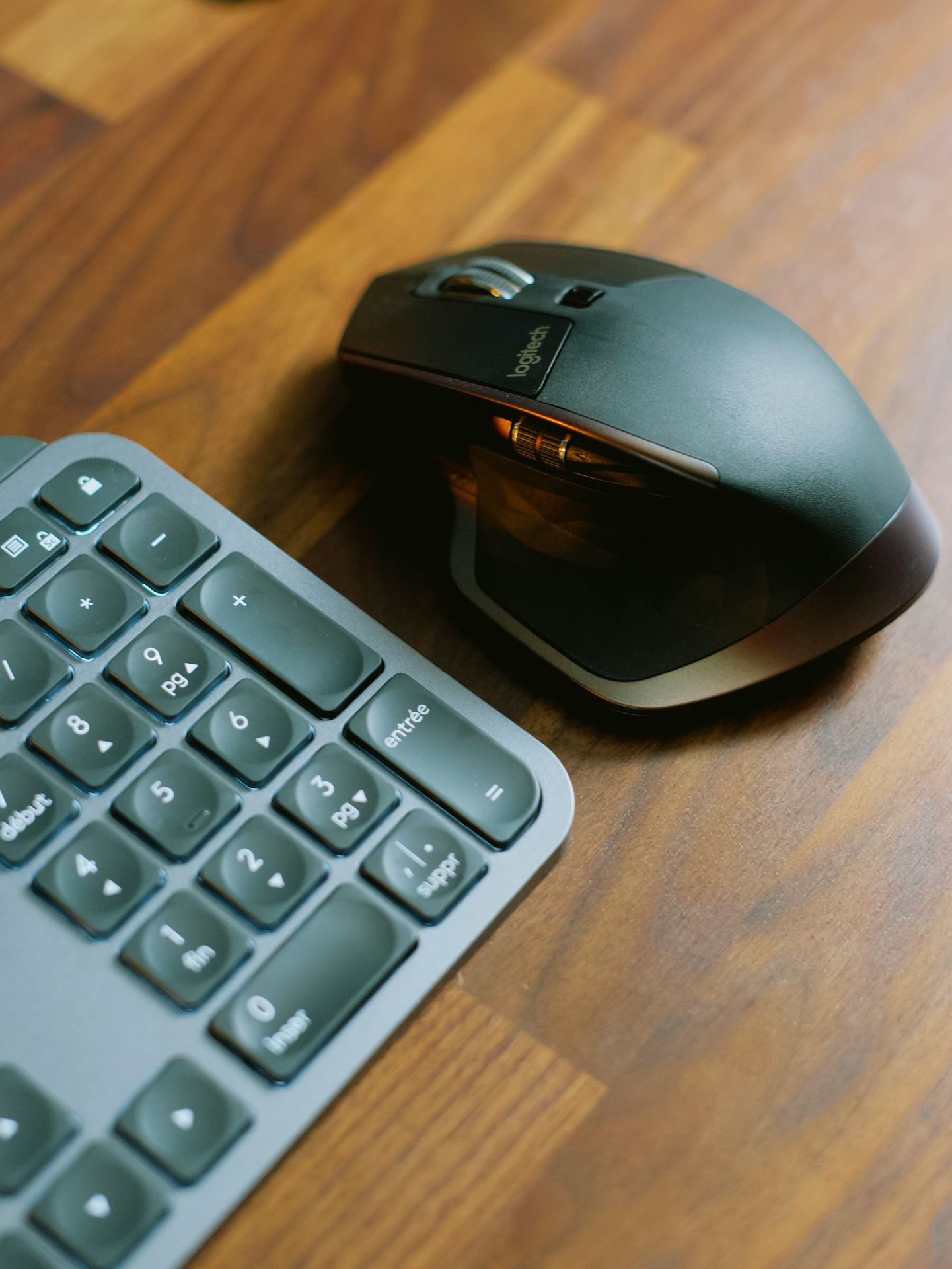 black cordless computer keyboard on brown wooden table